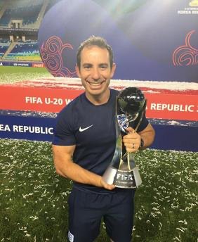 Al Stewart holding the FIFA U-20 World Cup trophy